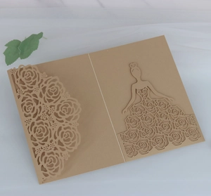 Detail of laser-cut rose and elegant woman silhouette on kraft paper wedding card