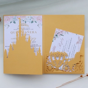 Golden laser cut Quinceañera invitation set with castle and carriage design details