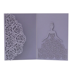 Detail of laser-cut purple floral invitation with elegant rose pattern and girl silhouette