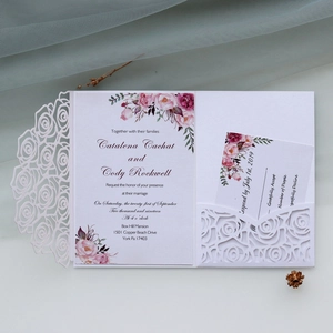 Detailed laser-cut rose pattern on white pearlescent paper wedding invitation set