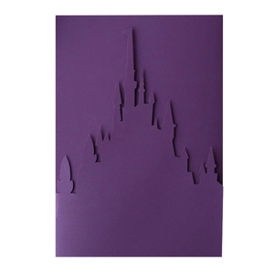 Detailed close-up of a laser-cut purple castle silhouette for wedding invitations