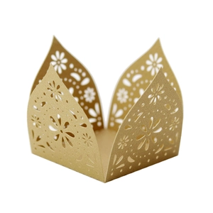 Detail of laser-cut gold hollow flower pattern for wedding cake lace edge decoration