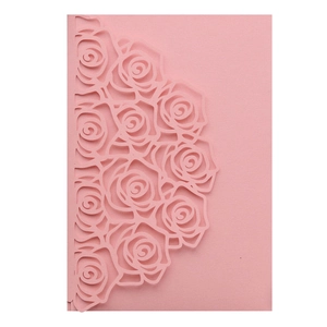 Detailed laser-cut rose pattern on premium pink pearlescent paper wedding invitation