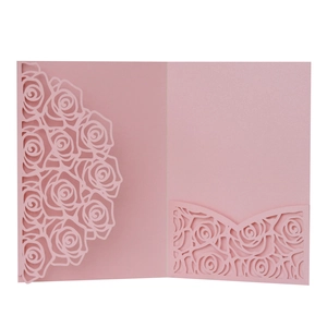 Detailed laser-cut pink rose pattern on pearlescent wedding invitation sleeve