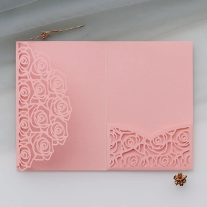 Detailed laser-cut rose pattern on pink pearlescent paper wedding invitation card