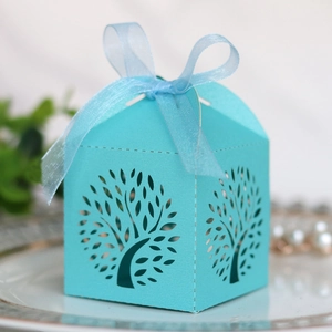 Detailed laser-cut tree design on tiffany blue wedding candy box with ribbon bow
