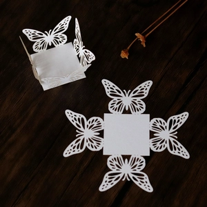 Detailed laser-cut white butterfly candy box for weddings and festive parties