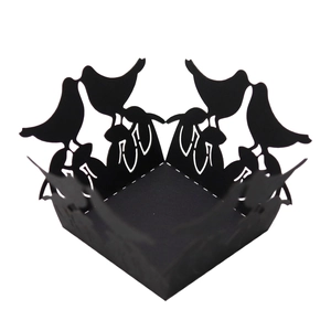 Detailed laser-cut black paper cupcake wrappers with elegant bird silhouette designs