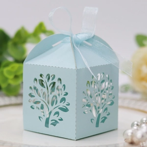 Close-up of light blue laser-cut tree candy box with matching sheer organza ribbon bow