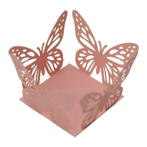 Detail of laser-cut pink butterfly candy box with lace pattern for baptism parties