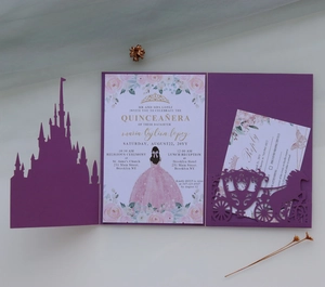 Detail of laser-cut purple castle invitation with carriage cutout and floral card