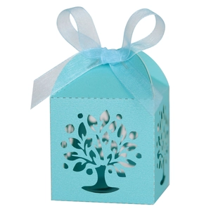 Detail of laser-cut tree design on tiffany blue candy box with elegant ribbon bow