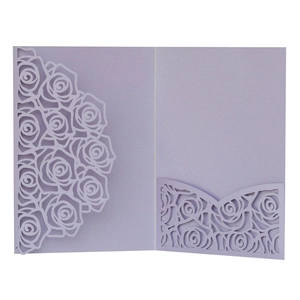 Detail of laser-cut lavender rose hollow wedding invitation with pearlized cardstock