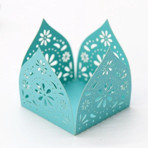 Detail of laser-cut floral pattern on Tiffany blue paper candy box for parties