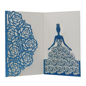 Detail of laser-cut glitter paper wedding invitation with rose pattern and girl silhouette