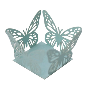 Detail of light blue laser-cut butterfly candy box with intricate lace patterns