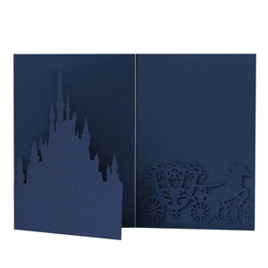Detailed laser cut navy blue wedding card featuring a castle silhouette and horse carriage