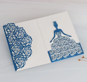 Detail of laser cut blue glitter card with rose patterns and female silhouette