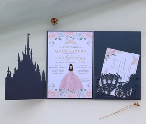 Detail of navy blue laser-cut castle invitation with gold print and floral inserts