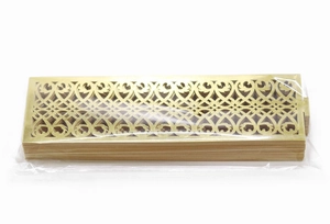 Detail view of laser-cut gold reflective napkin rings in original clear plastic packaging