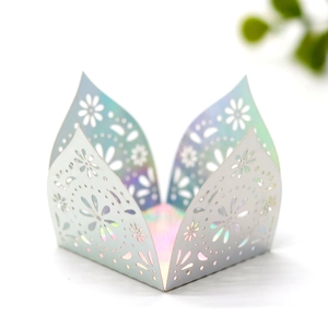 Detail of laser-cut iridescent chocolate box with elegant floral hollow patterns