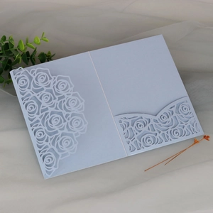 Light blue laser-cut rose wedding invitation card with elegant floral lace details