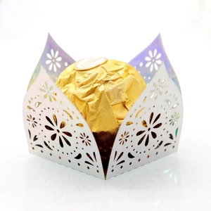 Elegant white laser-cut hollow candy holder with floral pattern for chocolate party favors