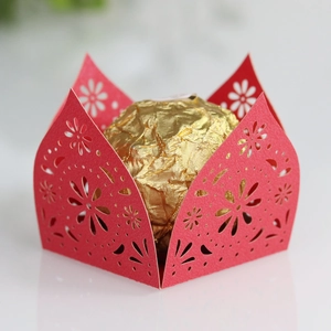 Detail showing red laser-cut floral hollow candy holder for wedding party favors