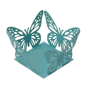Macro shot of laser-cut hollow butterfly candy box base in elegant blue cardstock paper