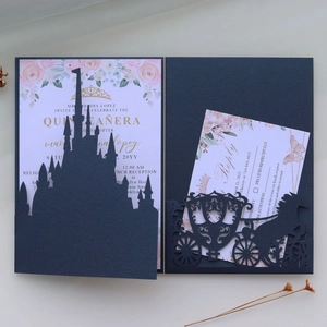 Detail of navy blue laser-cut castle and carriage invitation for Quinceañera event