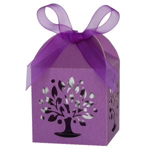 Detail of purple laser cut gift box featuring intricate tree patterns and silk ribbon bow