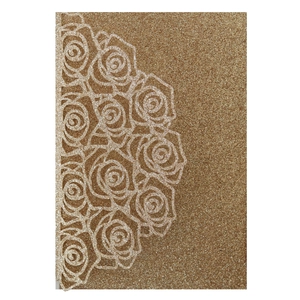 Detail of laser-cut rose hollow pattern on champagne gold glitter wedding invitation card