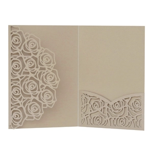 Detail of champagne gold laser cut rose invitation cover with pearlescent paper finish