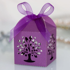Detailed laser-cut tree design on deep purple candy gift box with elegant organza ribbon