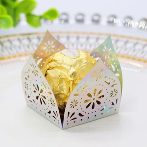 Macro view of laser-cut iridised paper candy box with intricate floral pattern