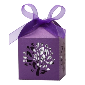 Detail of laser-cut Tree of Life candy box in purple pearlescent paper with ribbon