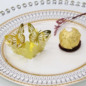 Laser-cut gold butterfly chocolate wrapper with decorative hollowed pattern for weddings