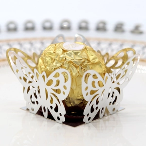 Macro shot of laser-cut butterfly hollow chocolate box with pearl paper texture