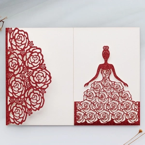 Detail of red glitter laser-cut wedding invitation featuring elegant rose flower hollow design