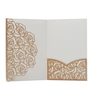 Detail of rose gold glitter cardstock with laser-cut rose floral hollow patterns