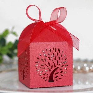 Detailed laser-cut tree design on a red wedding candy box with an elegant organza ribbon