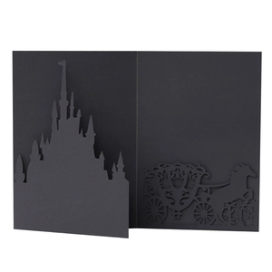 Detail of 3D laser cut black castle and horse carriage silhouette wedding card