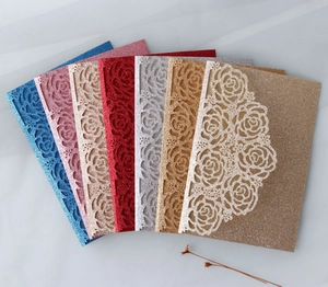 Laser-cut glitter paper wedding invitations in seven vibrant colors with rose patterns