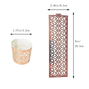 Detailed view of laser cut paper cupcake wrapper with heart and vine pattern specifications