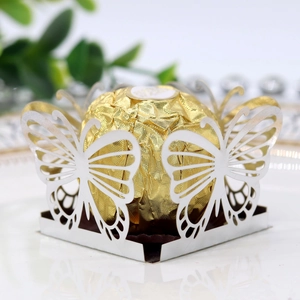 Detail showing laser-cut silver butterfly candy box with mirror finish for weddings