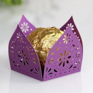 Close-up of purple laser-cut candy box with elegant floral hollowed-out patterns