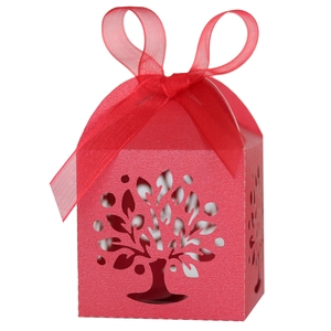Detail of red laser-cut Tree of Life candy box with elegant organza ribbon bow
