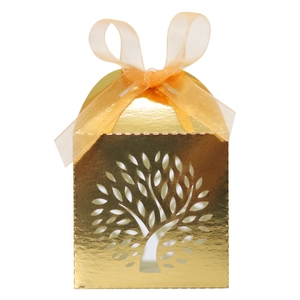 Detail view of golden laser-cut tree of life gift box with elegant orange ribbon bow
