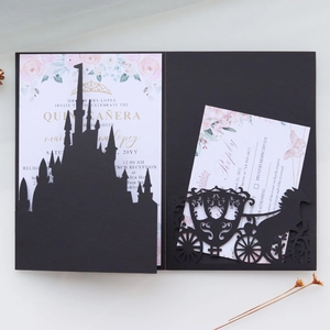Detail view of laser-cut castle envelope and carriage RSVP card for wedding invites