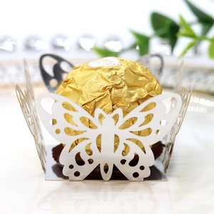 Laser-cut butterfly chocolate holder showing detailed white lace pattern for weddings